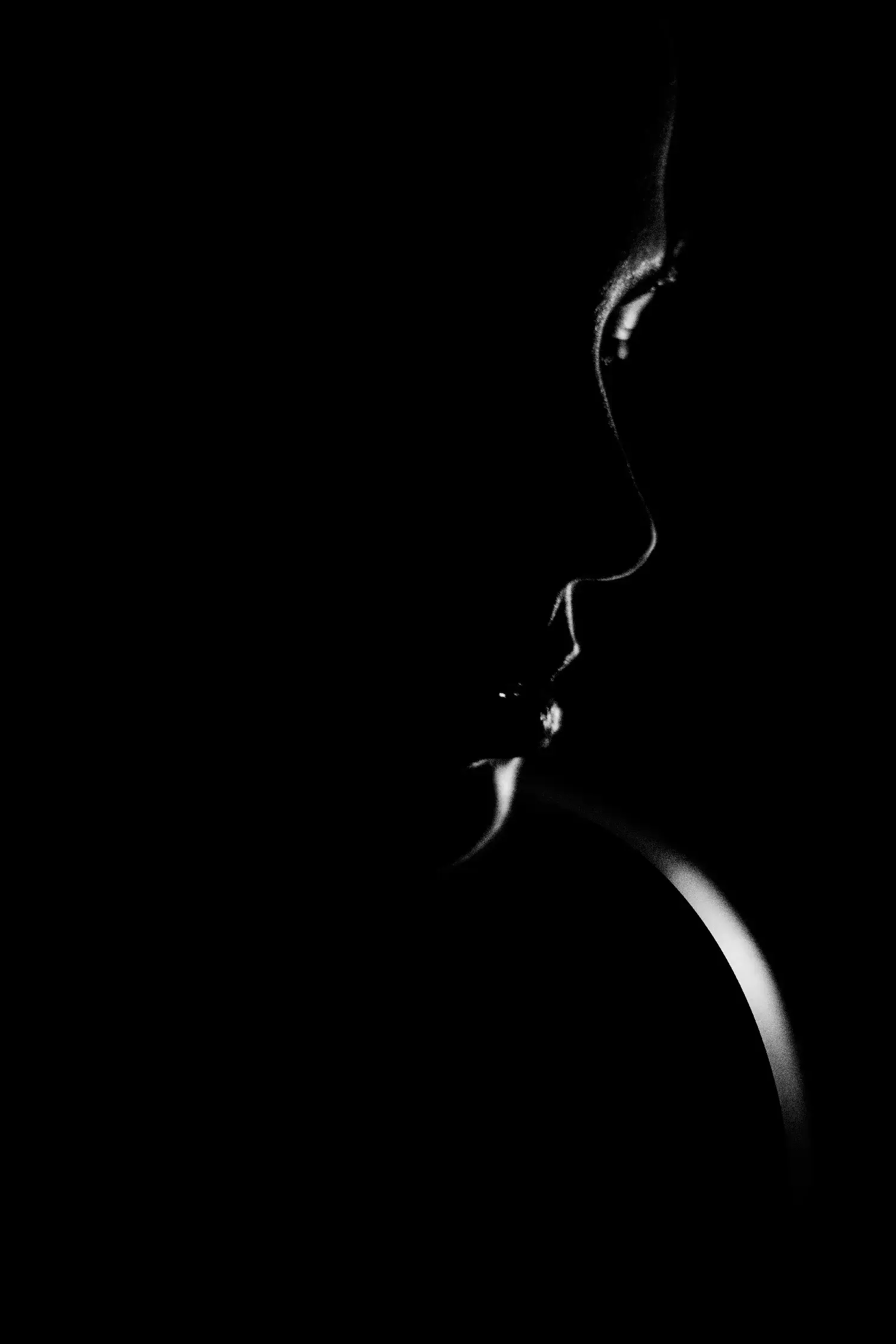 Minimalist low key female silhouette profile photography for high end digital design concepts